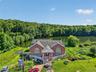 This lakefront home features 6 bedrooms, 4 bathrooms, and direct access to the private lake, complete with its own boat dock.