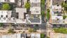 Rooftop solar panel array, flat roof design, and green roof sections