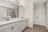 master bathroom with dual sinks