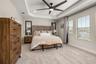master suite with tray ceiling