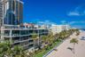 Direct beach access and panoramic ocean views throughout the unit.