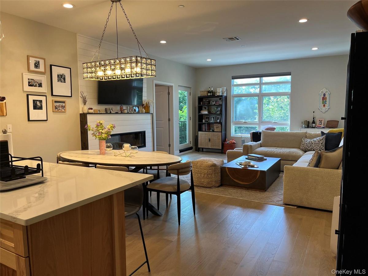 Open view from kitchen showing dining area and living room.