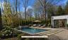 Conceptual rendering illustrating a potential pool utilizing a portion of the existing heated six-car garage as a future pool house. Pool not currentl