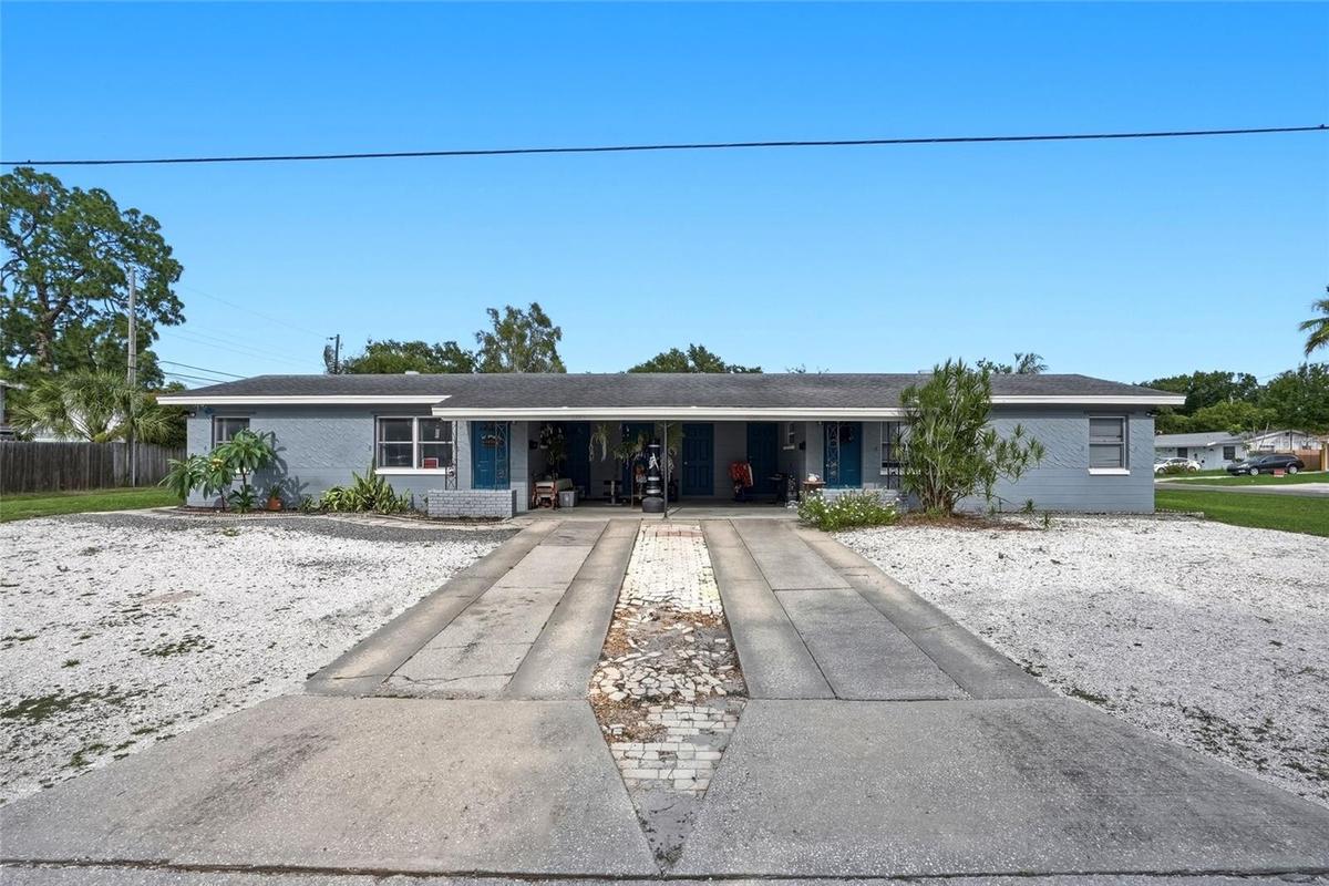 Ample parking for both residences in their private carports, out front, along the corner lot and in the spacious driveways