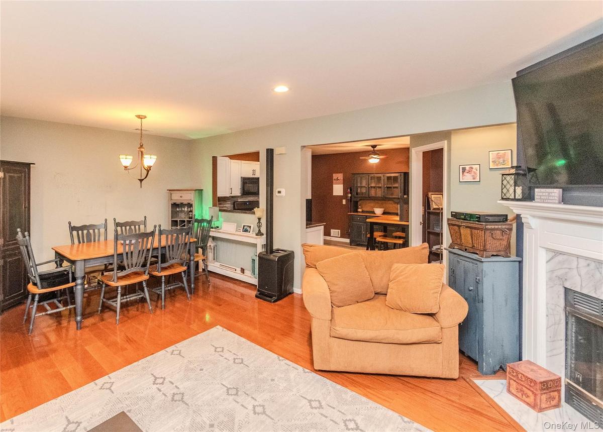Roomy and inviting living area/dining area with pass through
