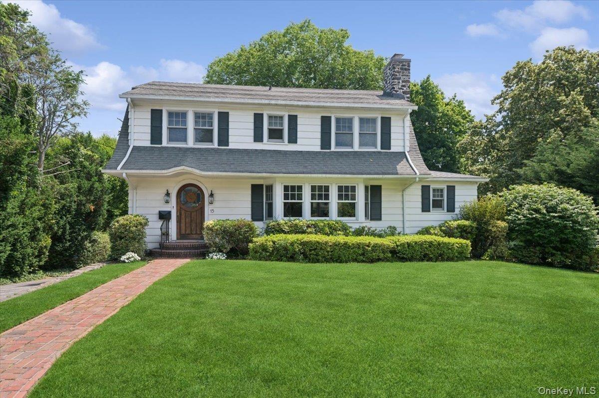 Classic curb appeal on a tree-lined street.