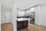 Kitchen and the door leads to the pool and Hyde Park Village
