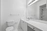 primary bathroom with a large vanity