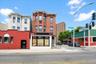 Brick commercial building with a ground-floor storefront