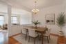 Warm wood-finish flooring complements the neutral wall tones