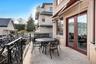 Balcony with french doors and outdoor dining area
