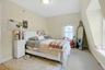 Bedroom with carpet flooring and baseboards