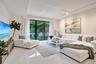 large living space with lush green views