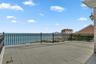 Upper terrace featuring a water view and outdoor FPLC