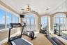 Exercise area featuring french doors, ornamental molding, carpet flooring, a ceiling fan, and recessed lighting