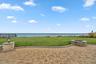 View of patio / terrace with a water view and a fire pit