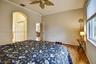 Spacious primary bedroom - hallway to his/her closets