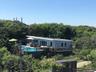 Back of property featuring a forest view