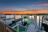 Endless evenings on the water, framed by a glowing sky and your private dock.
