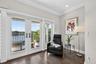 The primary suite captures breathtaking water views enhancing the home’s luxury living experience.