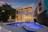 Waterfront pool retreat offering seamless indoor-outdoor entertaining and picturesque water vistas.