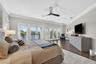 Spacious primary suite offering serene water views and a true retreat-like ambiance.