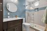 A generous third bedroom complete with a refined, private ensuite bath.