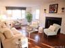 Large living room with woodburning fireplace