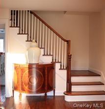 Graceful staircase in center hall