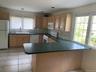 Kitchen with L shaped island counter