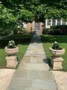 Large setback of house with handsome planters