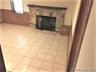 Basement den with gas fireplace