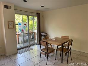 Large  kitchen dining area access to deck