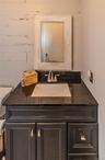 Full tiled updated upper level bathroom with barn siding