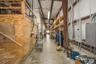 Warehouse storage area and access to mezzanine.