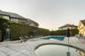 Outdoor pool and spa with extensive paver patio