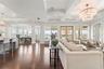 Expansive open living space that moves seamlessly between the living room, dining room, and kitchen flowing to your private outdoor balcony with stunn