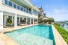 Poolside seating area with beautiful waterfront views.