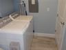 Inside laundry room with washer/dryer
