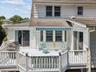 The deck is a fantastic entertaining space and has doors to the kitchen & sunroom.