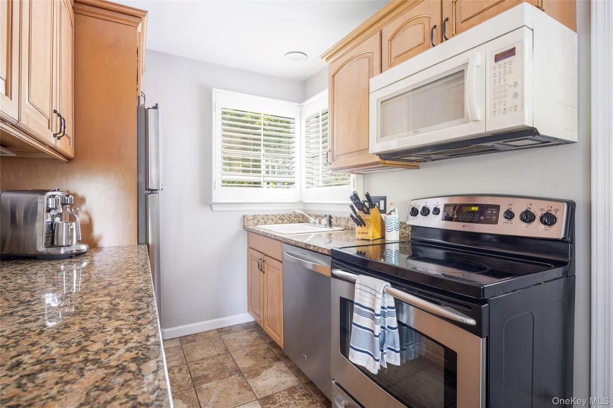 Galley kitchen with stainless steel appliances