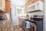 Galley kitchen with stainless steel appliances