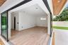 1st Floor Primary Bedroom - zero-corner sliding glass doors opening directly to the pool and spa