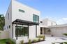 Front patio with elegant trellis detail and direct access to the office through sliding glass doors