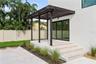 Front patio with elegant trellis detail and direct access to the office through sliding glass doors