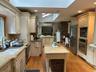 Full view of an expansive kitchen with removable island
