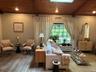 This sitting area is located in front of the fireplace, a great place to relax