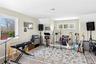 Rec room with light wood-style flooring