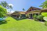 Pool and gardens surrounding home on a .78 acre lot.