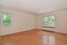 Bedroom #2 with sunny exposures and oak hardwood